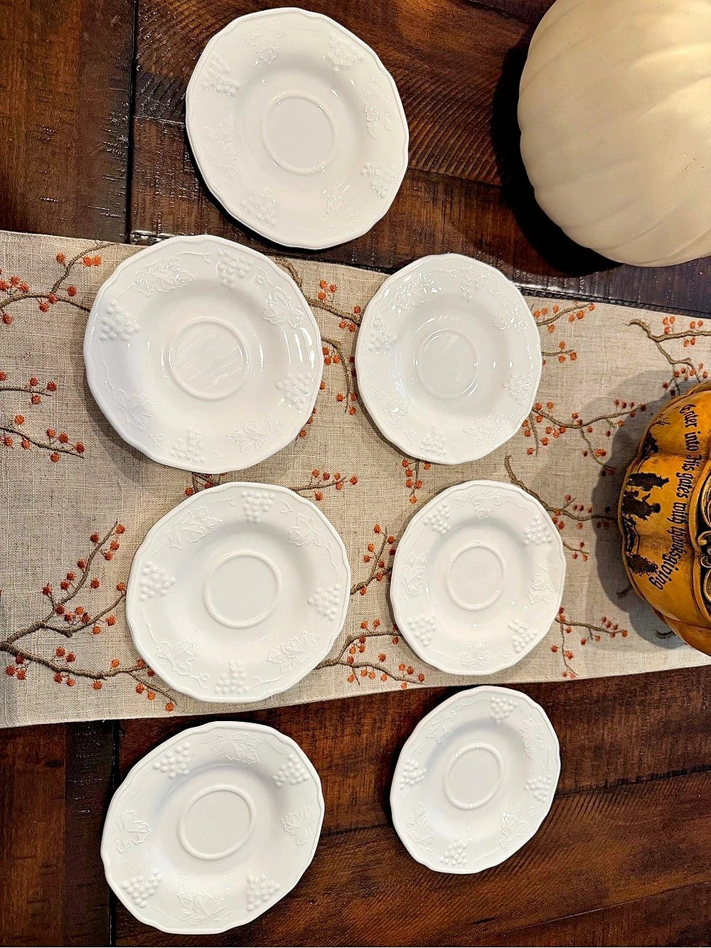 White Embossed Leaf and Grape Saucer Set of 7. Milk glass.